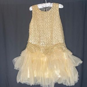 Trish Scully girl’s gold and white wedding dress.